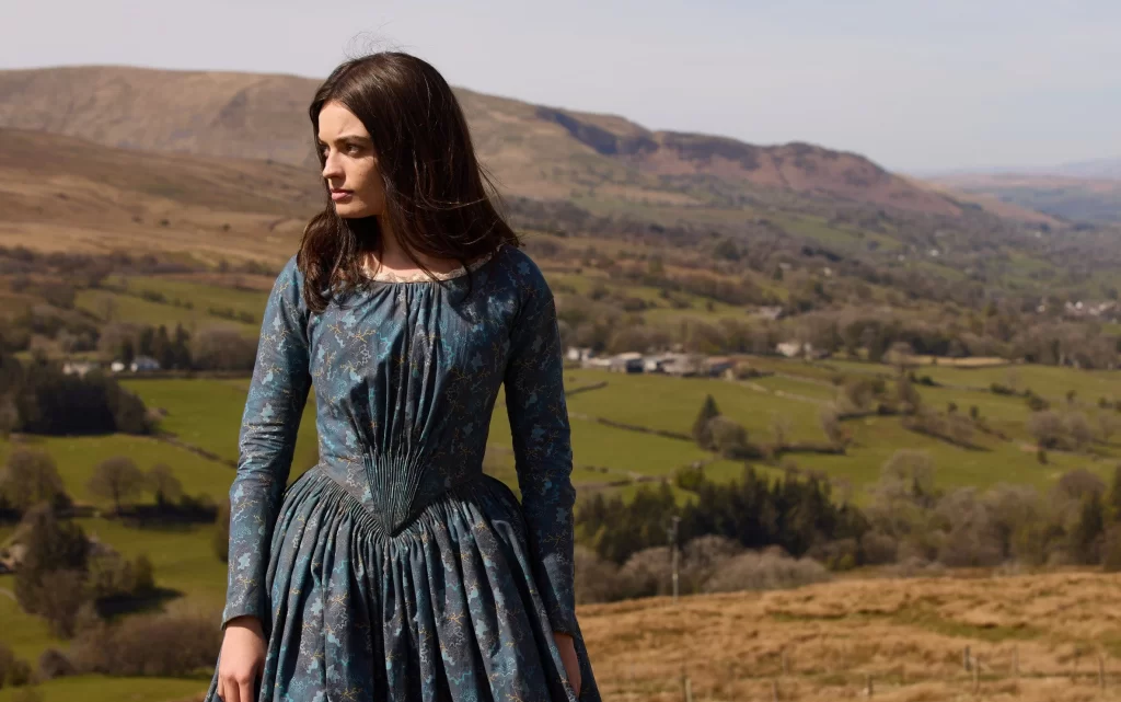 Emma Mackey como Emily Brontë