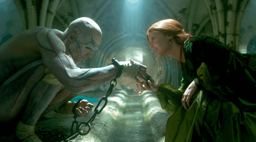 A imagem apresenta uma cena entre a criatura de Frankenstein e Elizabeth no subsolo do castelo