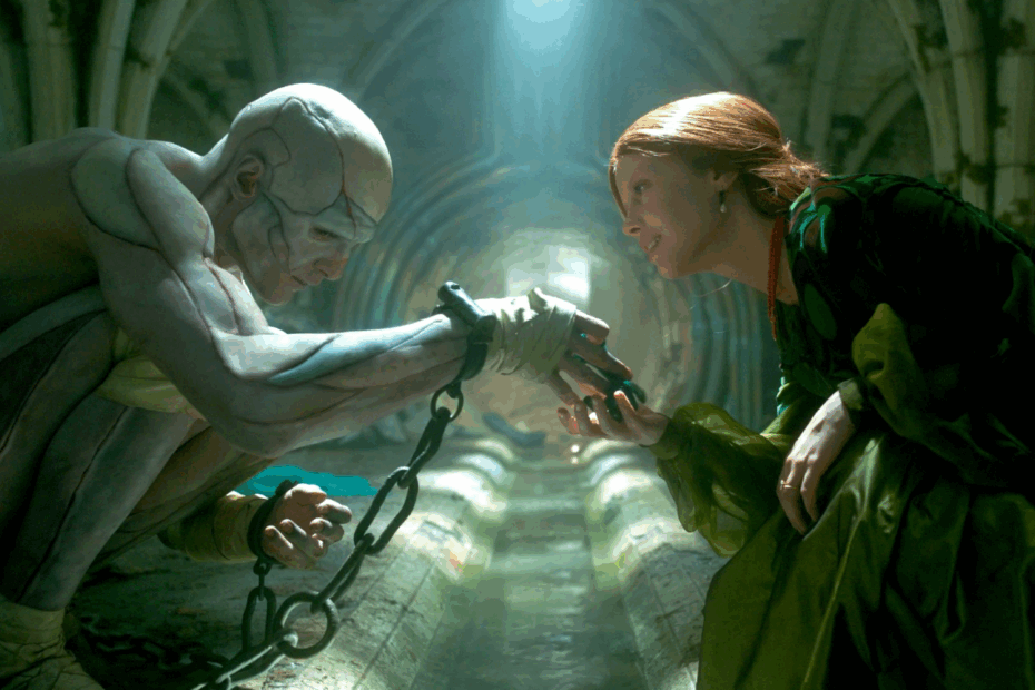 A imagem apresenta uma cena entre a criatura de Frankenstein e Elizabeth no subsolo do castelo